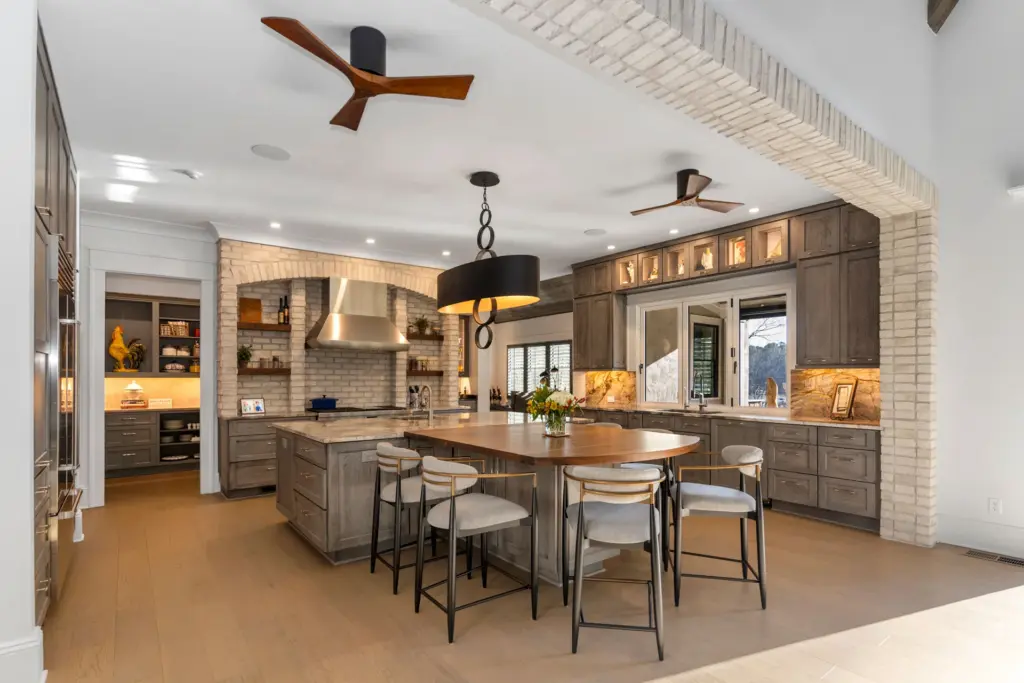 image of luxurious home interior, focusing on a dining area and a kitchen - custom home builder | Southern Luxury Homes