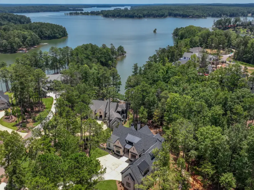 aerial view of houses and lake