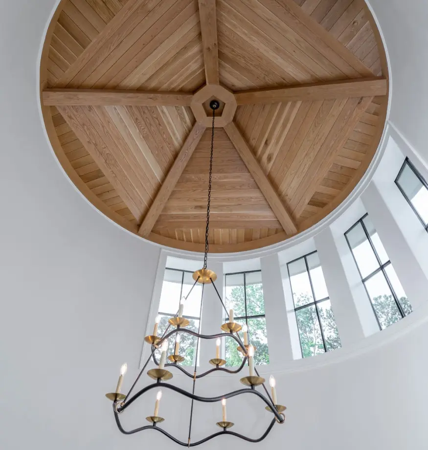image of a circular wood-clad celing detail, with candle light chandelier - custom home builder